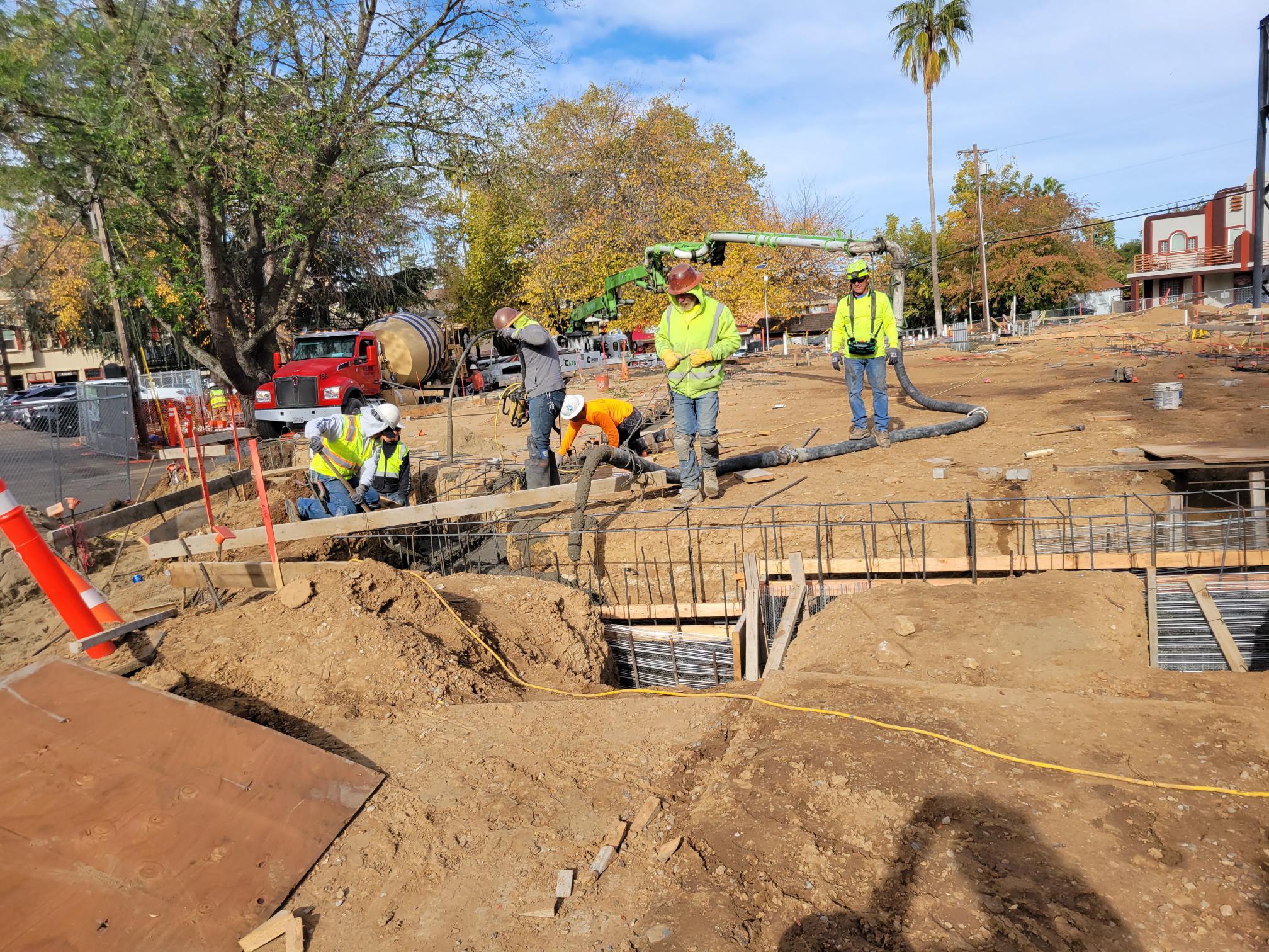 construction workers pouring cement