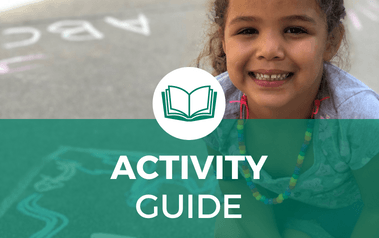 Activity Guide - image of young girl drawing in chalk on sidewalk and smiling