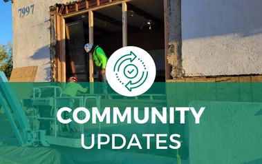 Community Updates - image of construction workers standing in open wall of building