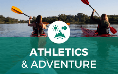Athletics and Adventure - image of two people kayaking on a lake