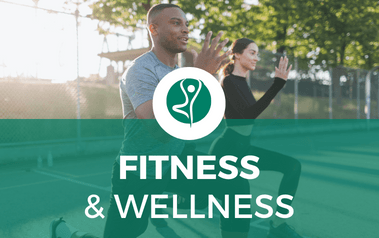 Fitness and Wellness - image of two people stretching on a court