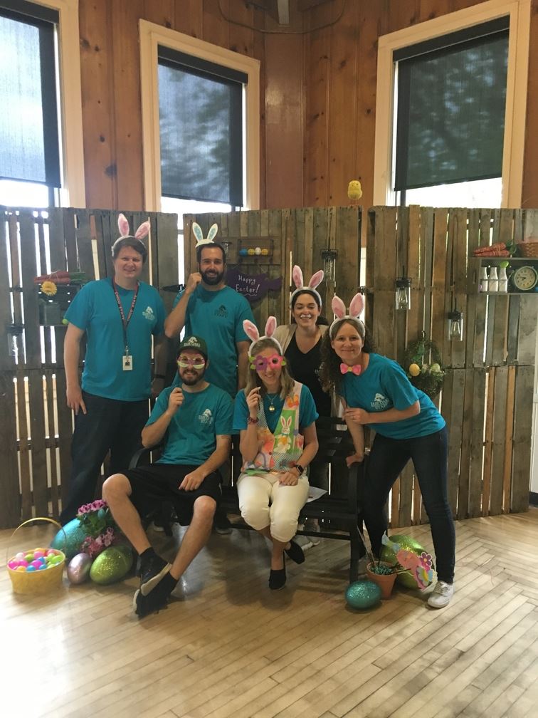 six adults posing for a photo