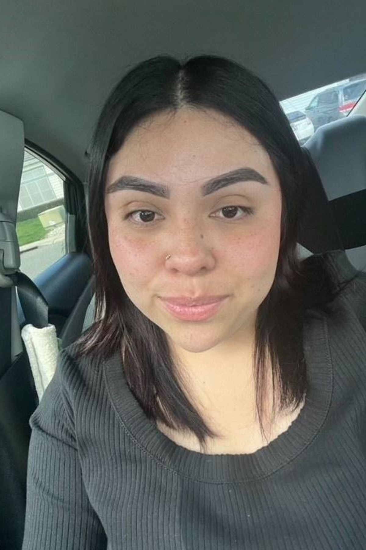 photo of staff member - selfie style in a car