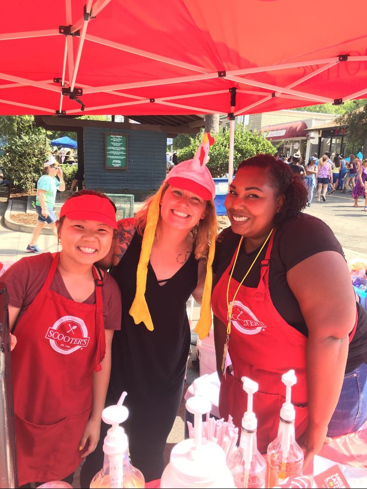 three women at Scooter's Coffee booth